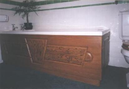 Bath panel - grained to match existing aged pine woodwork.